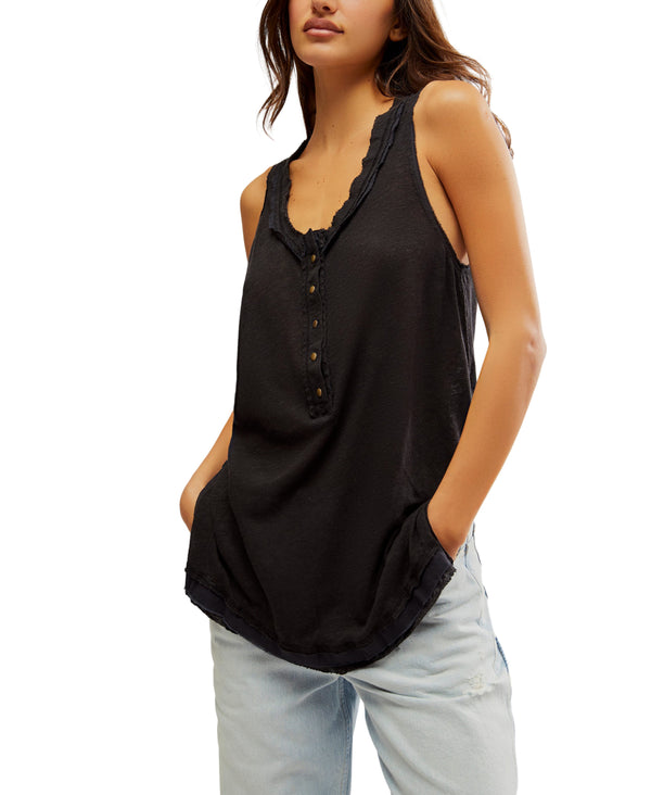 Woman wearing light weight tank with henley inspired design in the color black