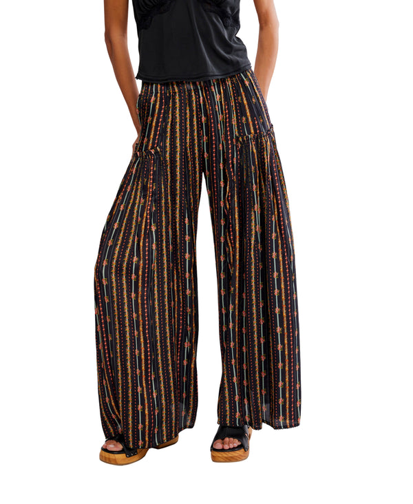Wide-leg pants with a striped pattern worn by a person on a white background