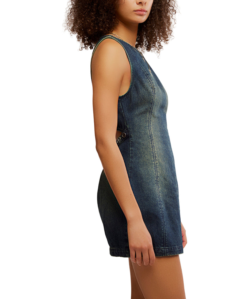 Woman wearing a denim dress on a white background