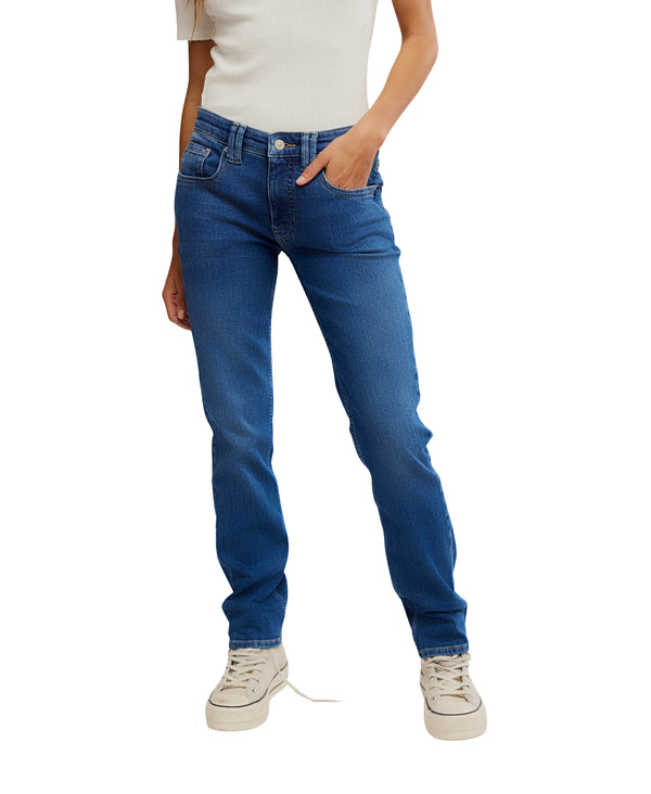 Person wearing blue jeans and white sneakers on a white background