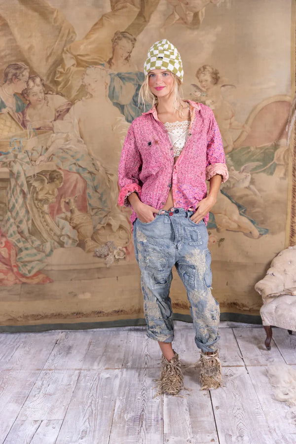 Woman wearing patchwork denim baggy pants with lace embroidered detail