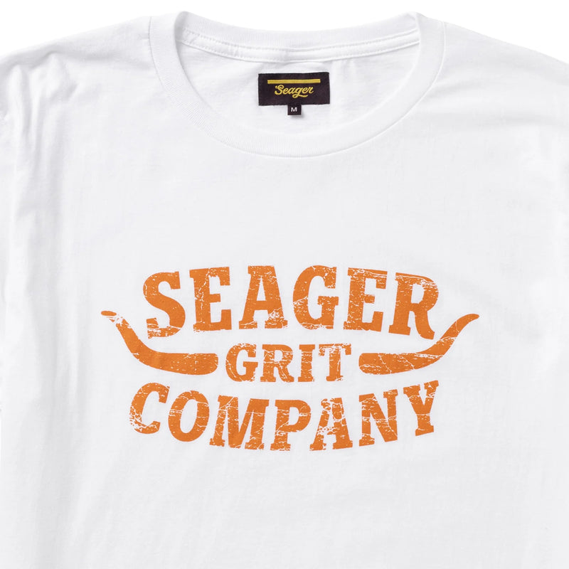 White short sleeve shirt with mustard yellow graphic "Seager Grit Company" on front with longhorns coming out of script
