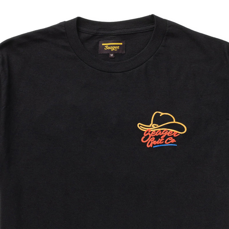 Black short sleeve t-shirt with graphic of a cowboy hat outline and "Seager Grit Co" in a primary colorway
