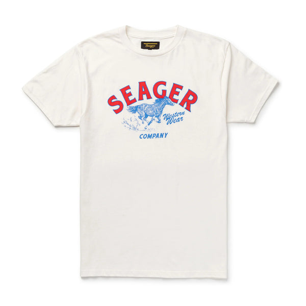 White short sleeve t-shirt with "Seager Western Company Western Wear" and horse running full speed in a red, white and blue colorway