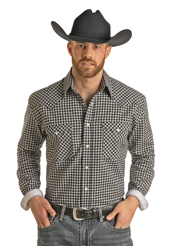 MAN WEARING BLACK AND WHITE LONG SLEEVE BUTTON DOWN SHIRT WITH DOUBLE BREAST SNAP POCKETS