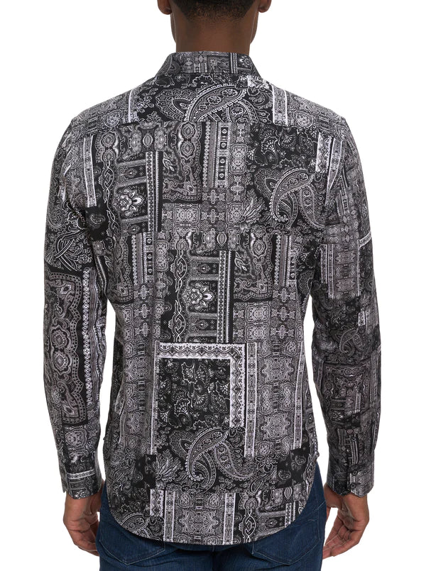 Man wearing black and white paisley button down shirt 