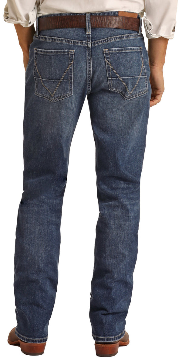 Man wearing medium wash boot cut blue jeans