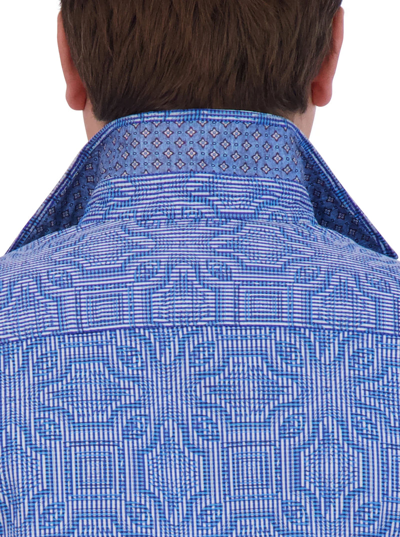 Man wearing long sleeve button up dress shirt with blue geometric pattern throughout