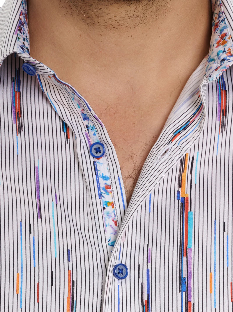 Man wearing button down long sleeve dress shirt with white background, thin stripes and multicolor streaks throughout