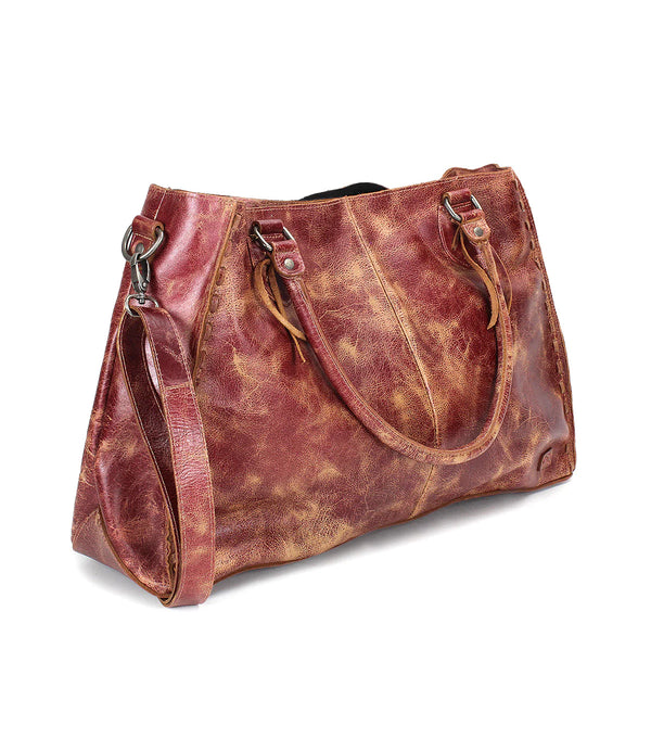 Brown leather handbag on a white background