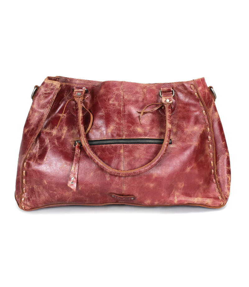 Brown leather bag with visible wear on a white background