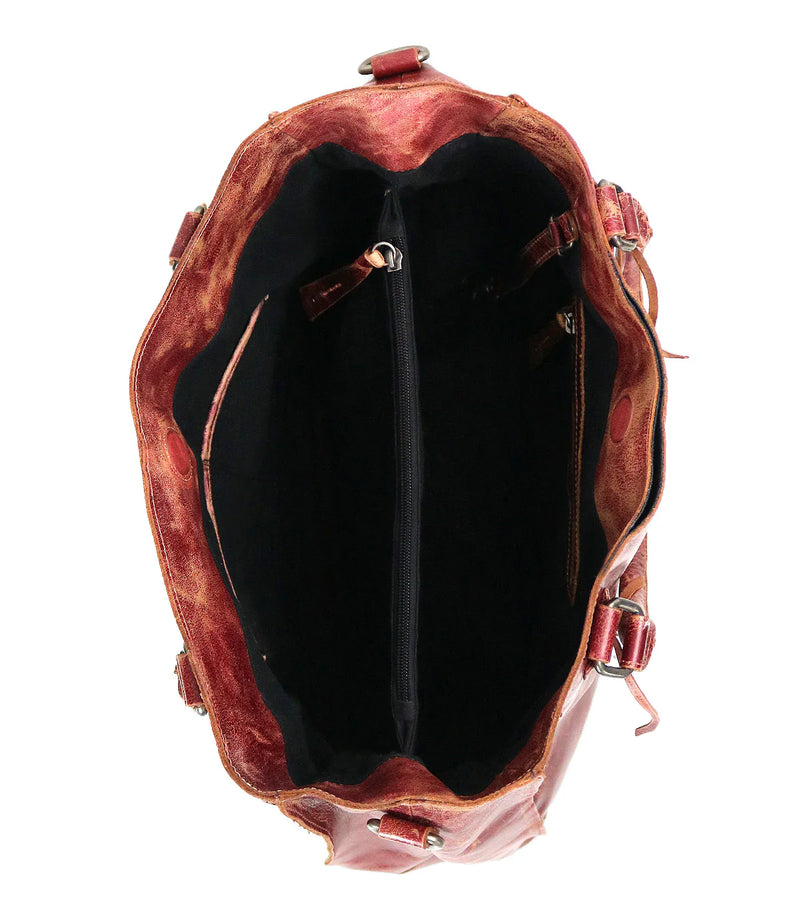 Brown leather backpack with open front showing black interior on a white background