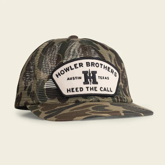 Mesh camo snapback cap with a off white and grey patch saying " Howler Brothers, Austin Texas, Heed the call"