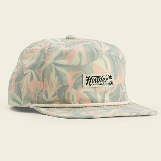 Snap back hat with palm leaves in a pink and green colorway with small Howler Brothers logo in the center and cream rope detail