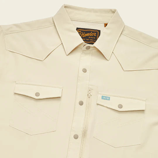 Short sleeve cream button front shirt with double breast pockets with button closures