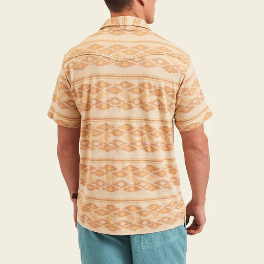 Tan polo shirt with darker tan and orange tribal pattern all over