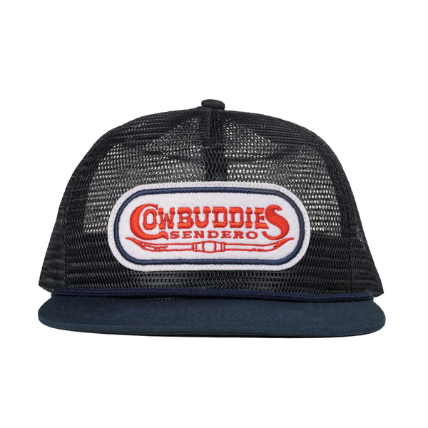Navy trucker hat with patch on front in an oval shape that says "Cowbuddies Sendero" and has a set of horns under it
