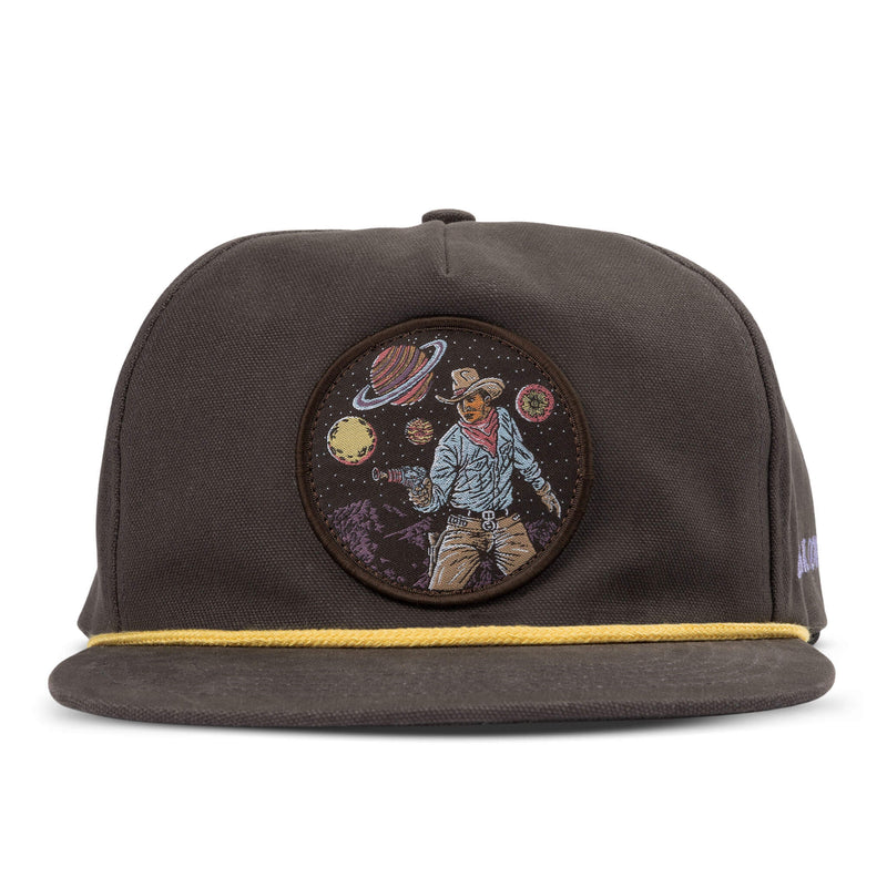 Grey snapback hat with patch of a cowboy drawing his gun with planets all around him, yellow rope detail and "cosmic cowboy" script on the side of the cap