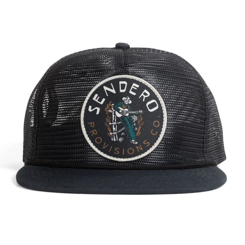 Black trucker hat with patch that has a skull cowboy playing a guitar with script "Sendero Provisions Co."