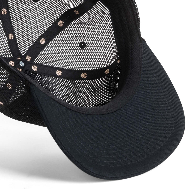 Black trucker hat with patch that has a skull cowboy playing a guitar with script "Sendero Provisions Co."