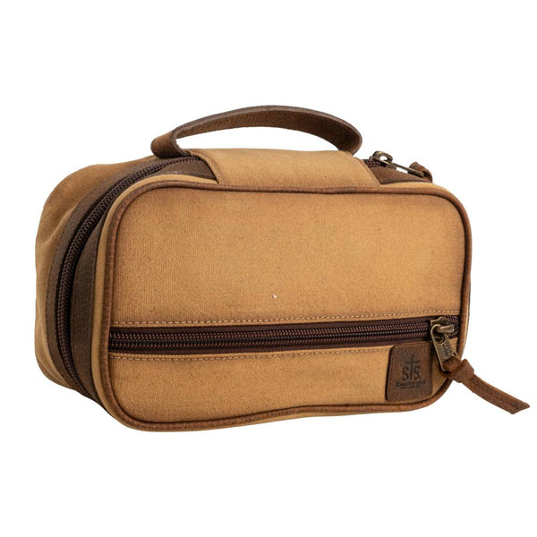 Tan canvas shave kit with chocolate leather handle and strips on the ends of the zippers. 