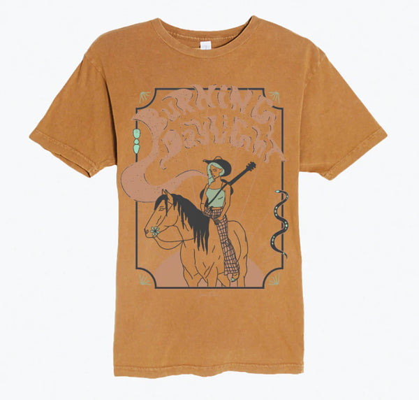 Brown tee shirt with abstract horse and cowgirl with letters spelling "Burning Daylight" above 