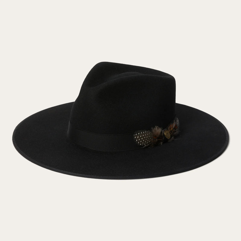 Black fedora hat with a feather detail on a light gray background
