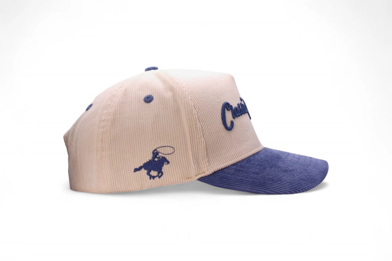 Beige and blue cap with logo on a white background