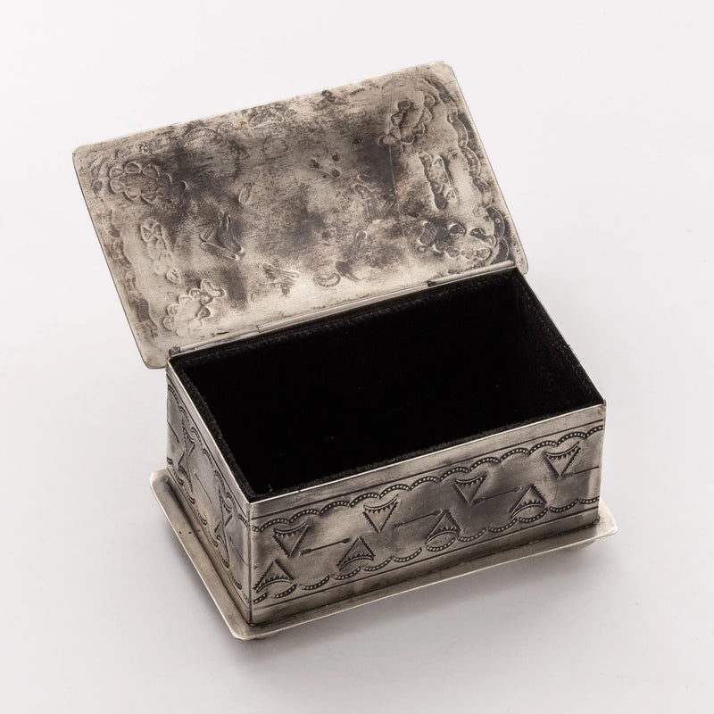 Silver box with thunderbird and tribal stamps all over