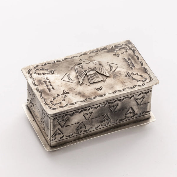 Silver box with thunderbird and tribal stamps all over