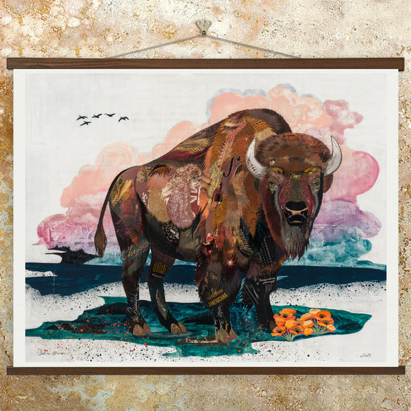 Contemporary art print features an American Bison standing watch against a hand-painted, sunset sky in tones of pink and purple. A signed, limited edition contemporary nature art print of an original paper collage artwork