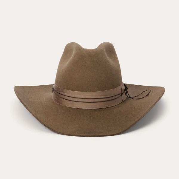Brown cowboy hat with leather band on a white background