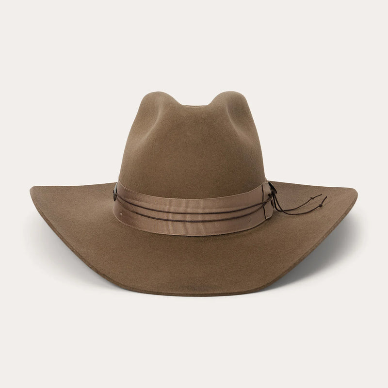 Brown cowboy hat with leather band on a white background