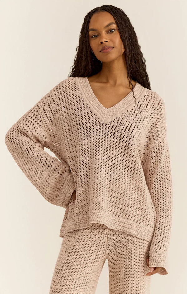Crochet sweater with dramatic v neck in a beige color 