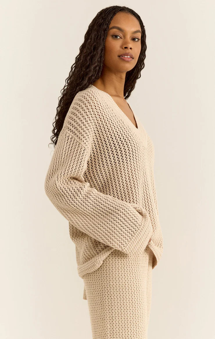 Crochet sweater with dramatic v neck in a beige color