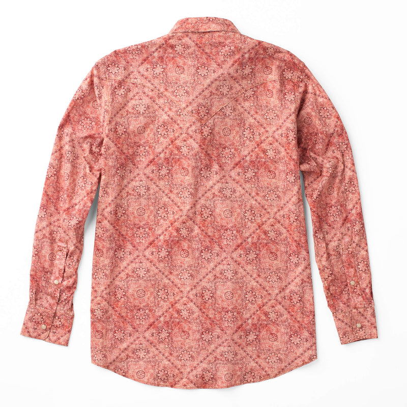 Woman's button up pearl snap long sleeve shirt with double breast pocket in a red bandana pattern
