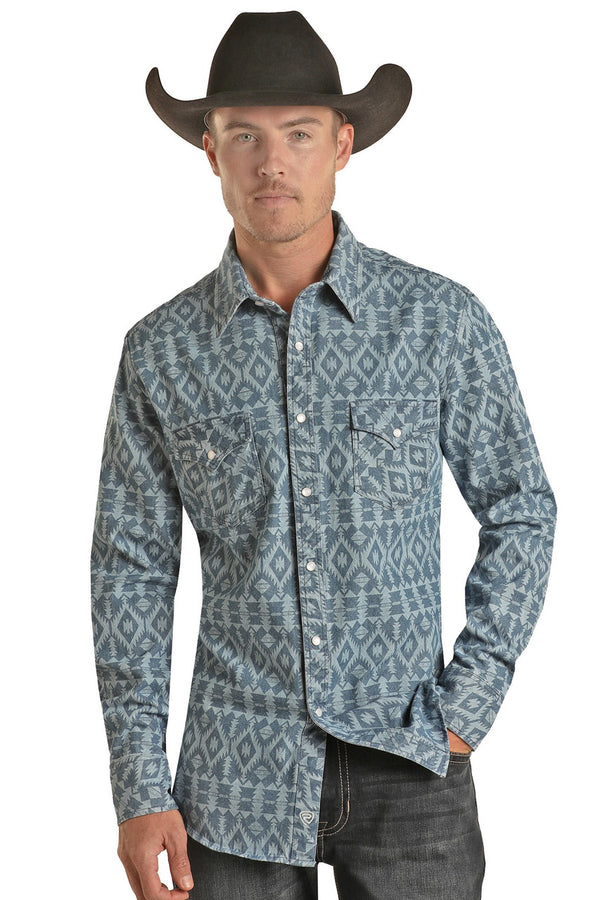 Man wearing blue aztec button down shirt with double breast pocket