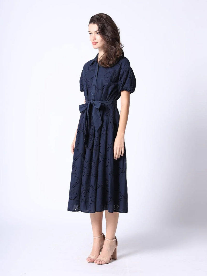 Navy eyelet embroidery dress with button front and matching belt and short sleeve puffy sleeves