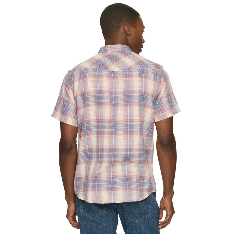 Man wearing a plaid short-sleeve shirt on a white background