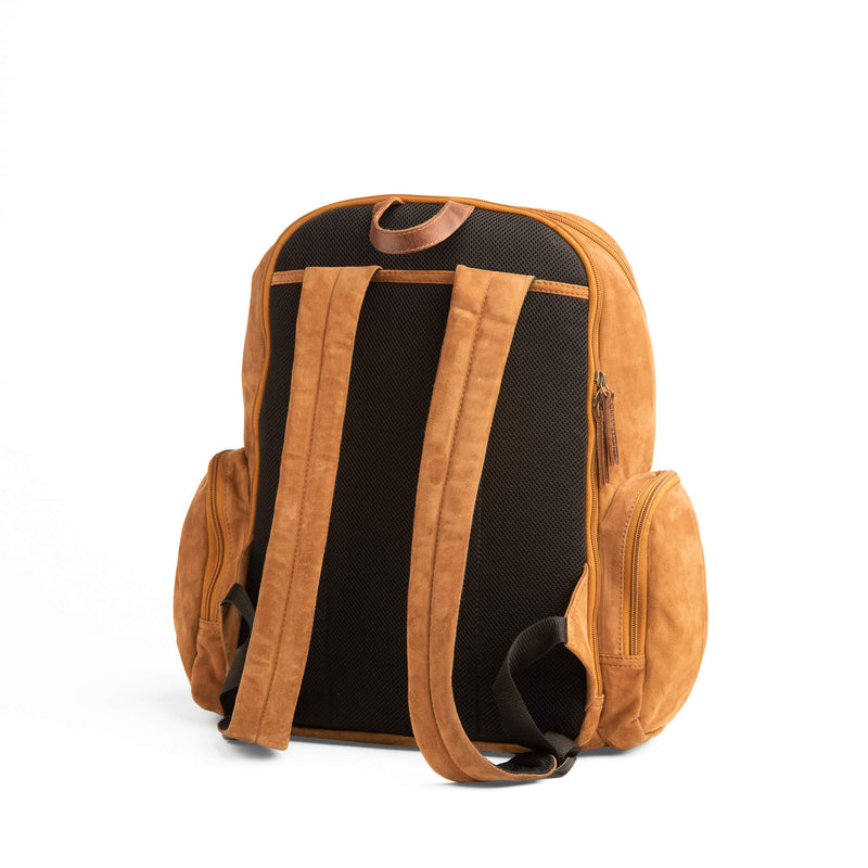 GOAT SUEDE BACKPACK WITH DOUBLE SIDE ZIPPER POCKETS WITH MAIN COMPARTMENT ZIPPER CLOSURE AND FRONT POCKET SNAP CLOSURE. INCLUDES LAPTOP CARRING COMPARTMENT AT PORTION CLOSEST TO THE BACK