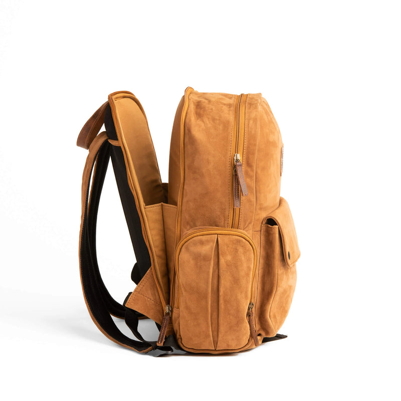 GOAT SUEDE BACKPACK WITH DOUBLE SIDE ZIPPER POCKETS WITH MAIN COMPARTMENT ZIPPER CLOSURE AND FRONT POCKET SNAP CLOSURE. INCLUDES LAPTOP CARRING COMPARTMENT AT PORTION CLOSEST TO THE BACK