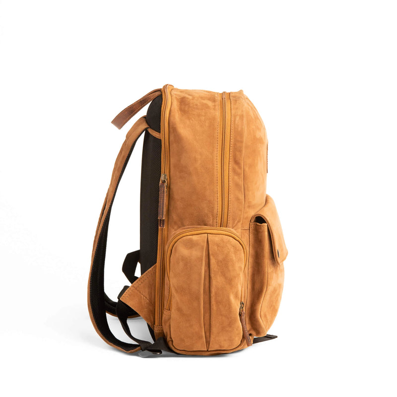 GOAT SUEDE BACKPACK WITH DOUBLE SIDE ZIPPER POCKETS WITH MAIN COMPARTMENT ZIPPER CLOSURE AND FRONT POCKET SNAP CLOSURE. INCLUDES LAPTOP CARRING COMPARTMENT AT PORTION CLOSEST TO THE BACK