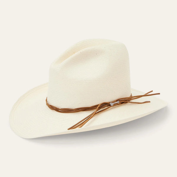 Beige fedora hat with a brown band on a light gray background