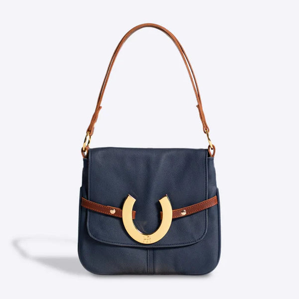 NAVY LEATHER BAG WITH GOLD HORSE SHOE WITH BROWN STRAP AND ATTACHMENT 