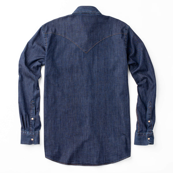 Classic pearl and wood grain snap front closure denim shirt, front and back yoke treatment, and saddle stitching.