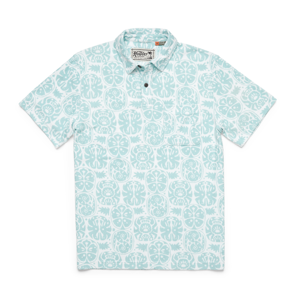 Men's shirt made from terrycloth and had a front breast pocket with collar and buttons at the top of the neck. The pattern is a Hawaiian floral print in a blue and white color way
