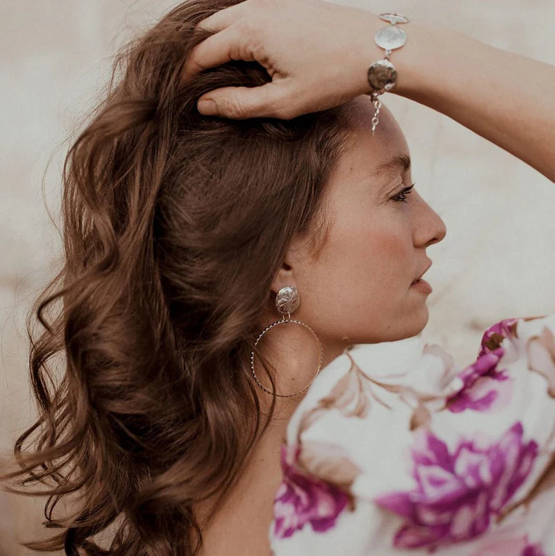 Sterling silver hoop earrings with concho posts