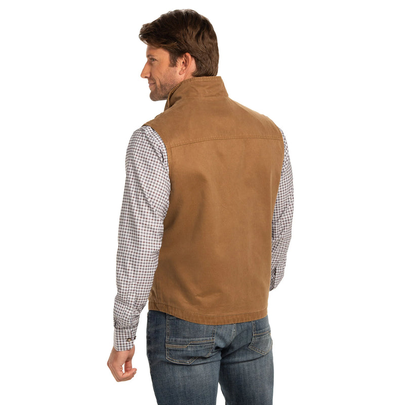 Man wearing a brown vest over a checkered shirt on a white background