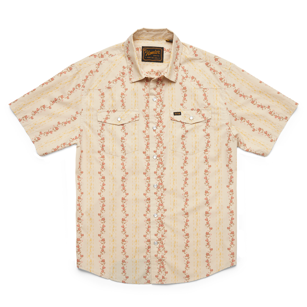 Men's pearl snap short sleeve shirt with red roses in stripe formation all over. Shirt also has double breast pearl snap pockets