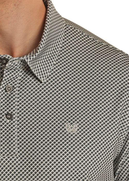 Man wearing short sleeve polo with geometric design
